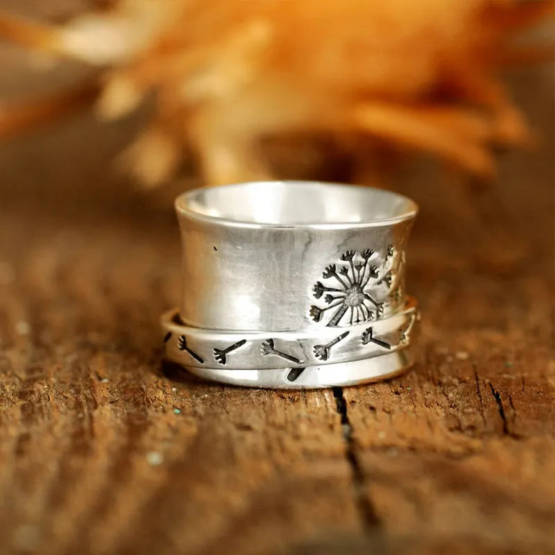 Silver rotatable flower ring with adjustable floral element and electroplated alloy construction