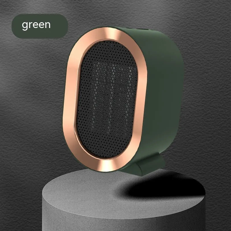 Compact black desktop electric fan heater with mechanical control dials and a safety grille.