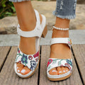 White women's high heel sandals with a Velcro buckle strap and a rubber sole.