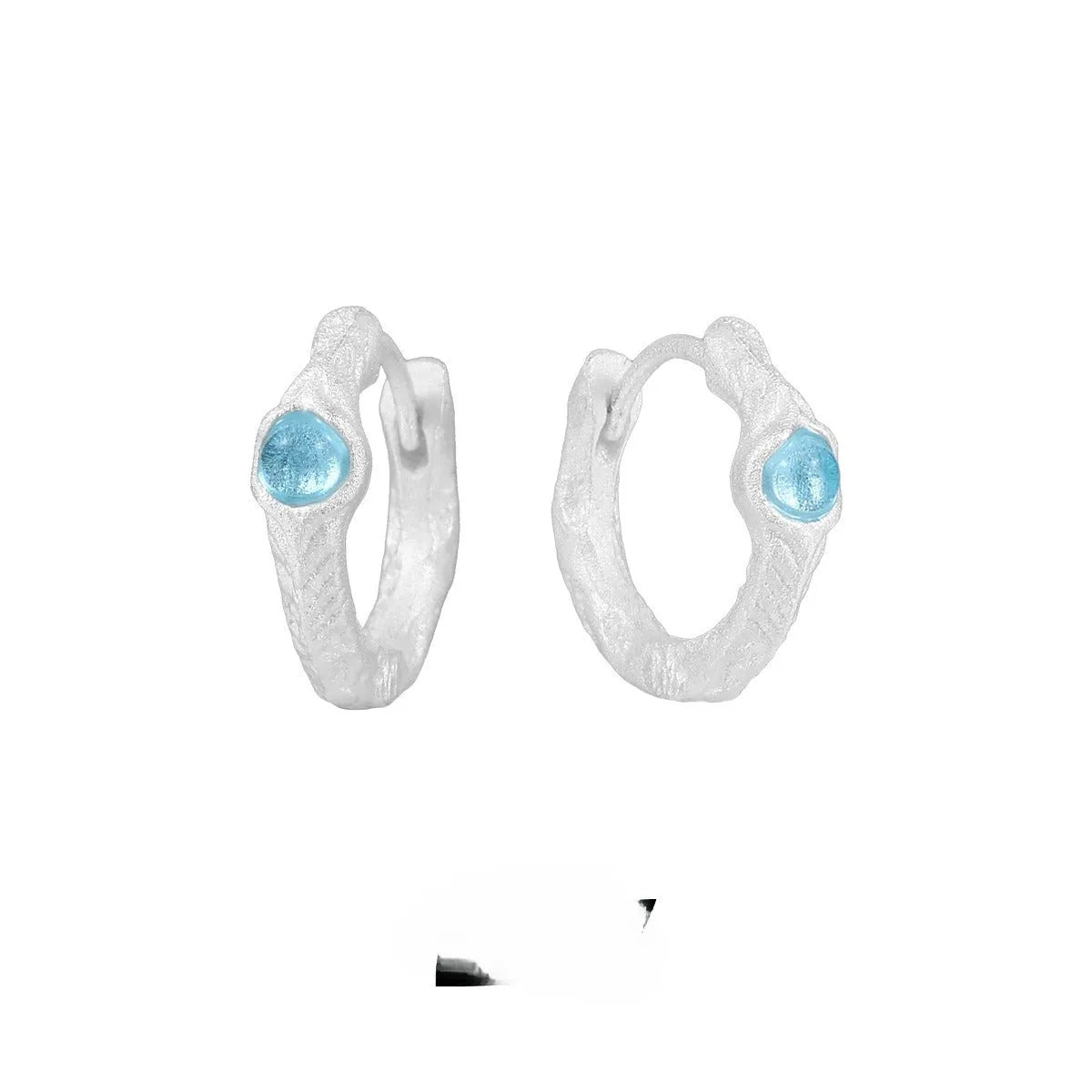 Geometric round ear clip in burnt silver tone, made from 925 silver with a clip-on back.