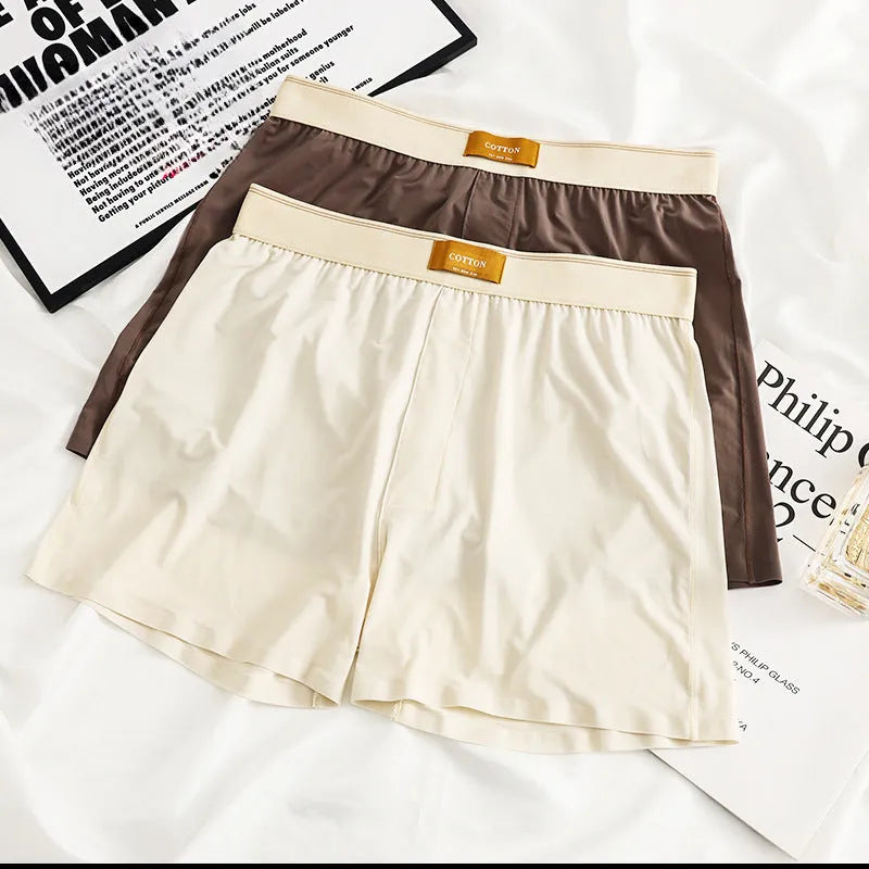 Men's loose fit ice silk underwear in solid colours showing mid-waist design and breathable fabric texture.