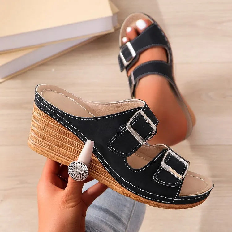Women's creamy-white wedge beach slippers with buckle strap closure on rubber sole