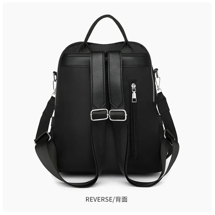 Large soft PU backpack in black with multiple pockets and internal mobile phone storage