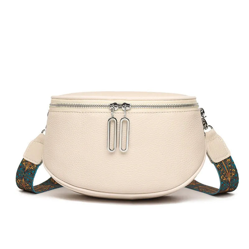 Women's soft PU leather messenger bag with saddle shape and crossbody strap in black, white or green colour options