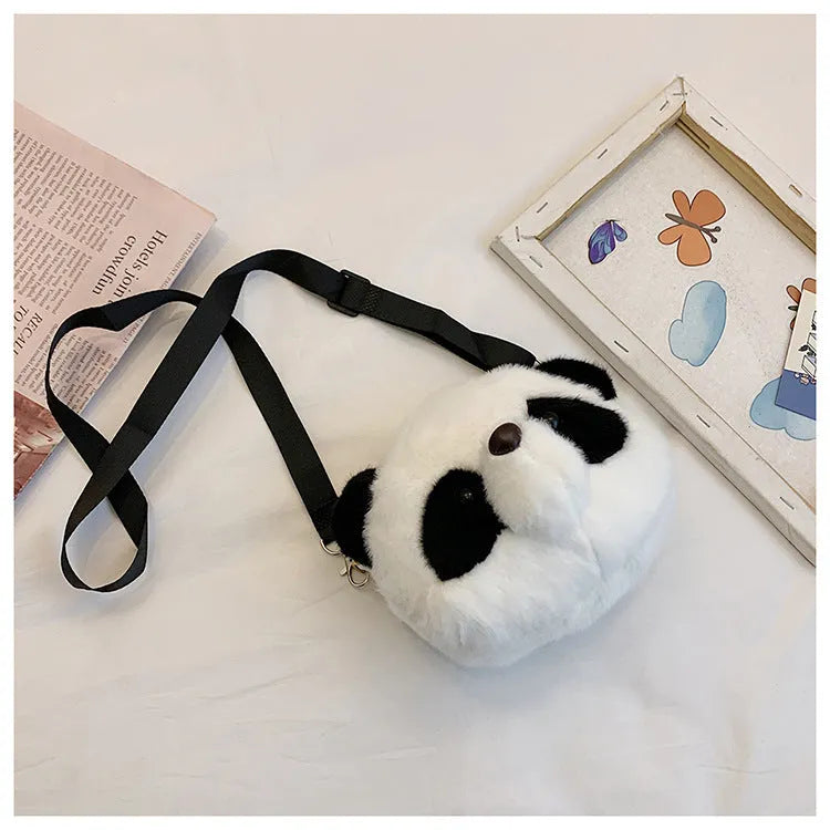 Cylindrical plush crossbody bag with panda head design showing outer sandwich pocket