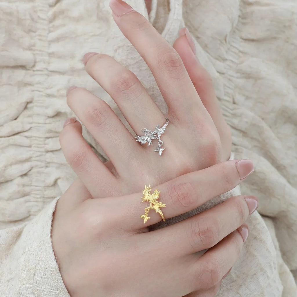 Adjustable silver butterfly ring with white gold or 18K gold electroplating, showing insect motif and open band design
