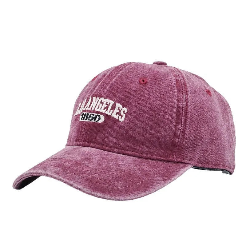 Personalised embroidered retro-style peaked cap in distressed beige with adjustable strap