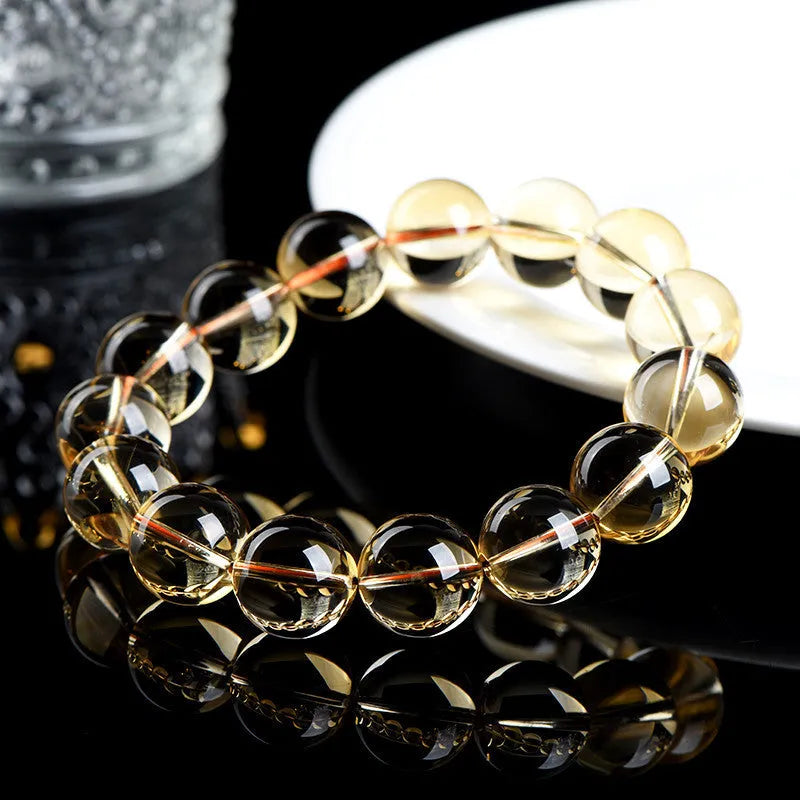 Natural citrine scattered beads ball bracelet showing polished gemstone beads on a wrist.