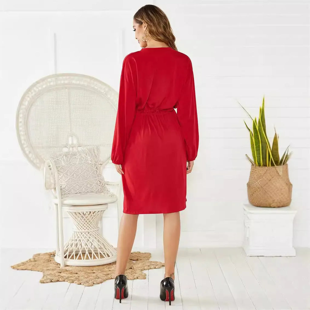 Black loose A-line midi dress with long sleeves, elastic cuffs, and an elasticated waist with a belt.