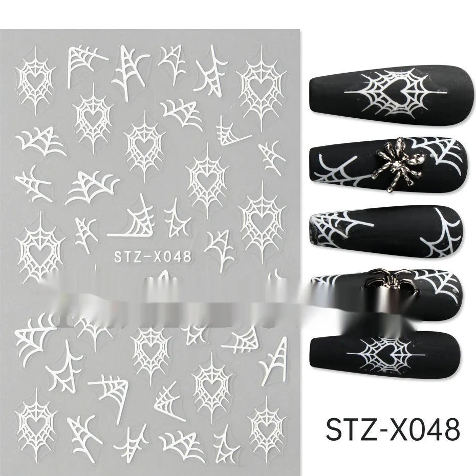 Close-up of a cartoon-style nail sticker with black and silver strips and a love pattern design on a fingernail.