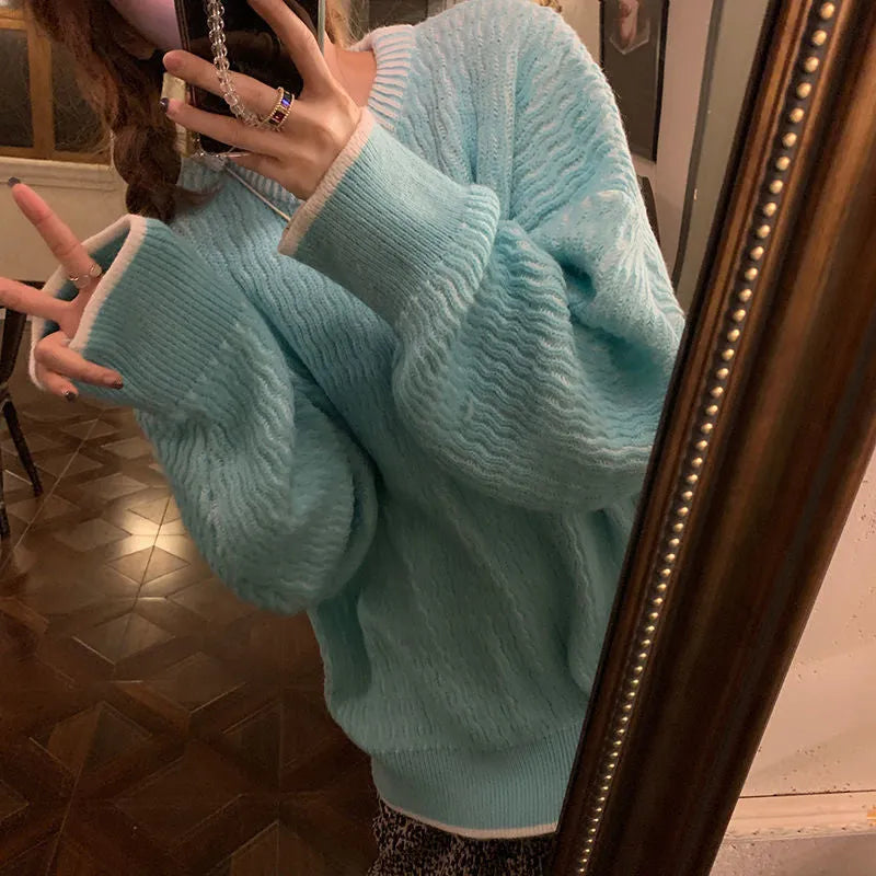 Women's loose pullover sweater in solid colour polyester fabric showing front view