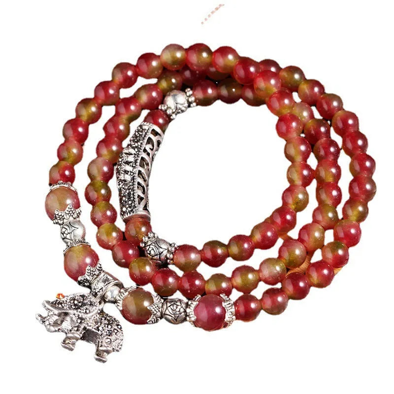 Handmade natural watermelon crystal bracelet with Chinese knot closure in geometric national style design