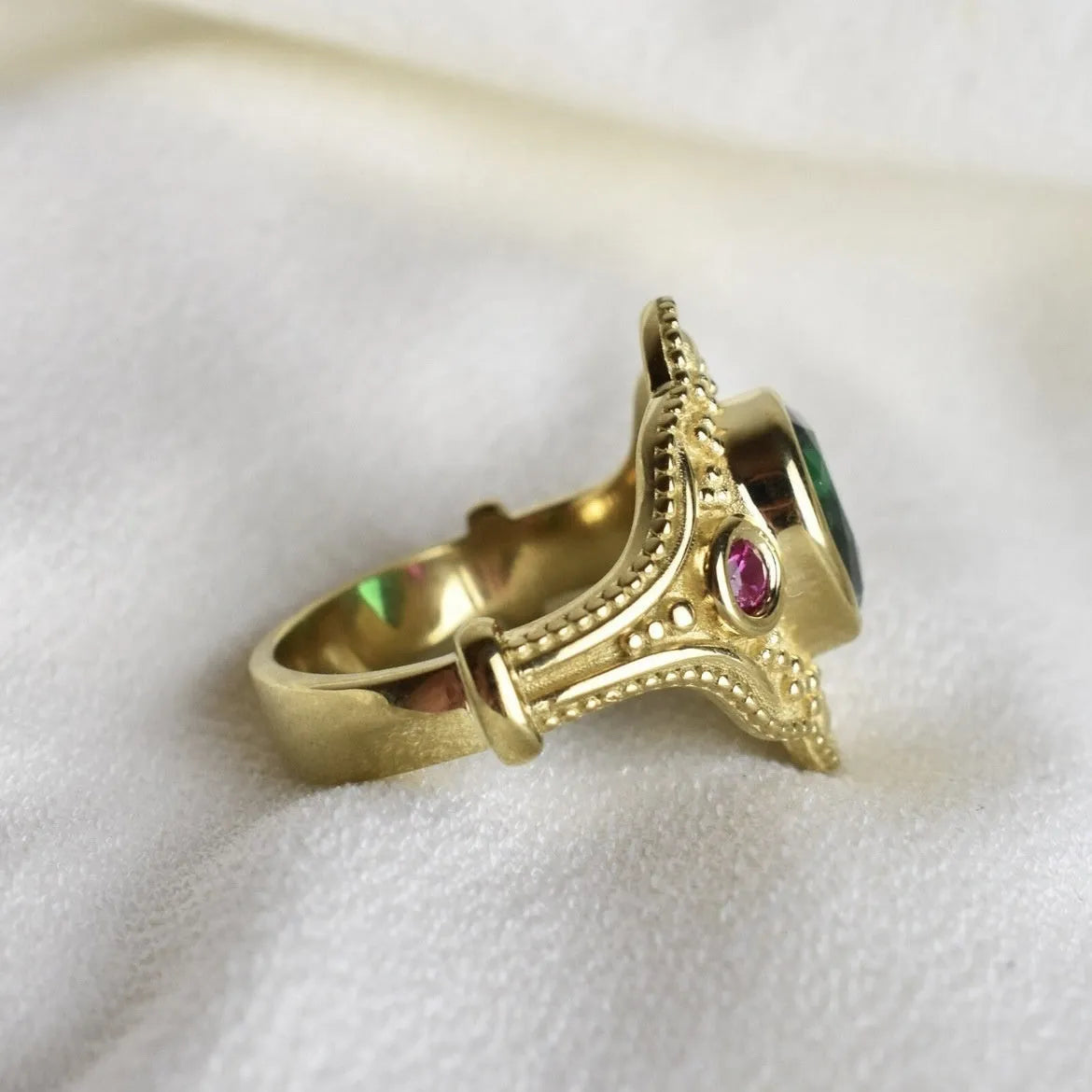 Women's gold-plated geometric ring with electroplated golden lvzuan finish showing side view