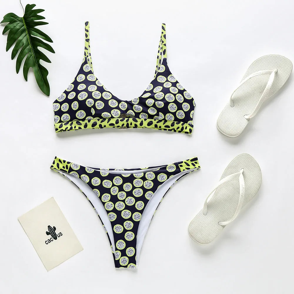 Women's polyester bikini swimsuit set in black and white dots pattern.
