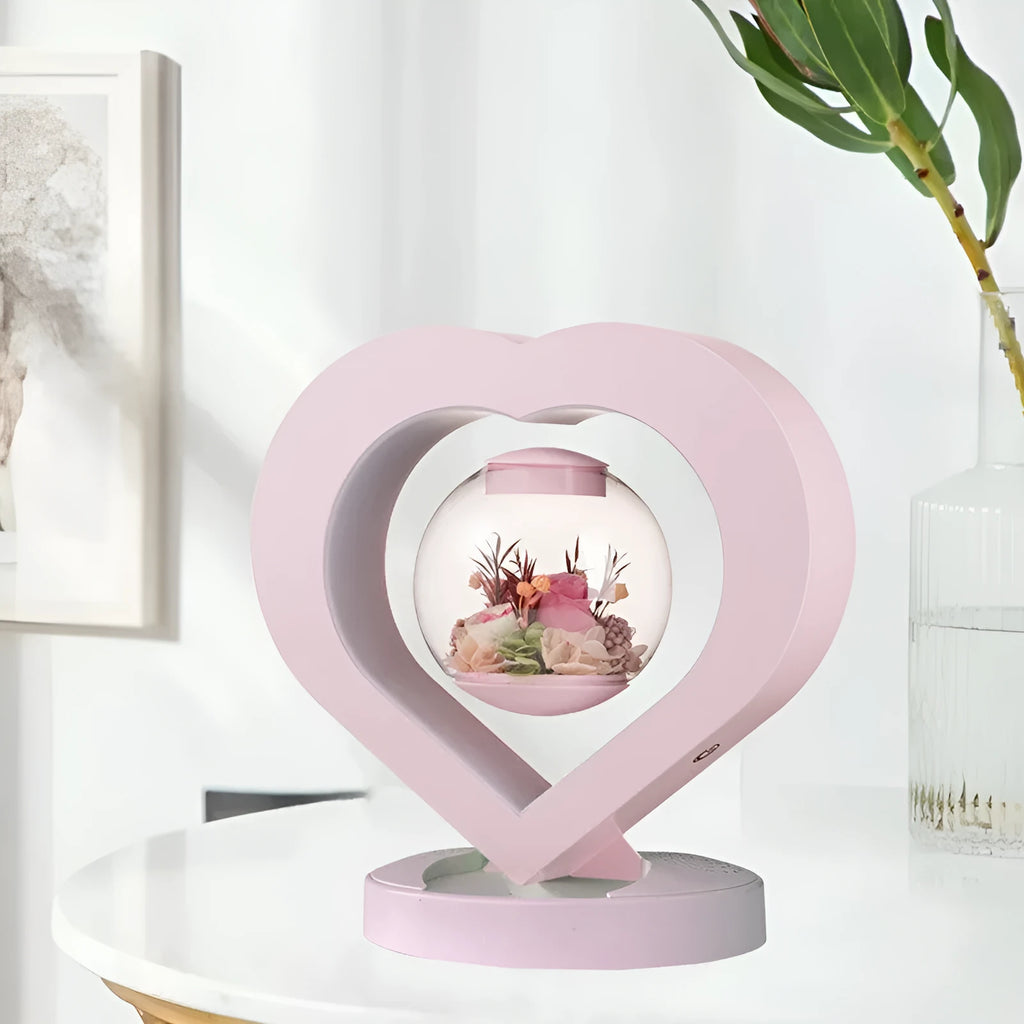 Pink preserved rose decorative ornament with optional base and Bluetooth speaker functionality.