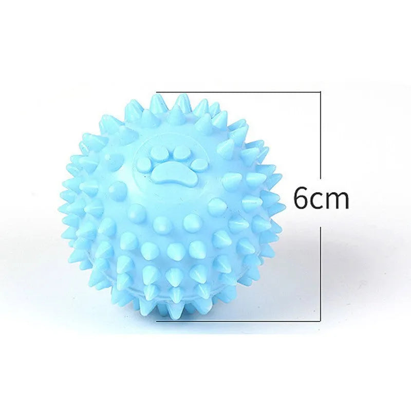 Blue, pink, or yellow TPR dog chewing ball with textured sides for tooth cleaning