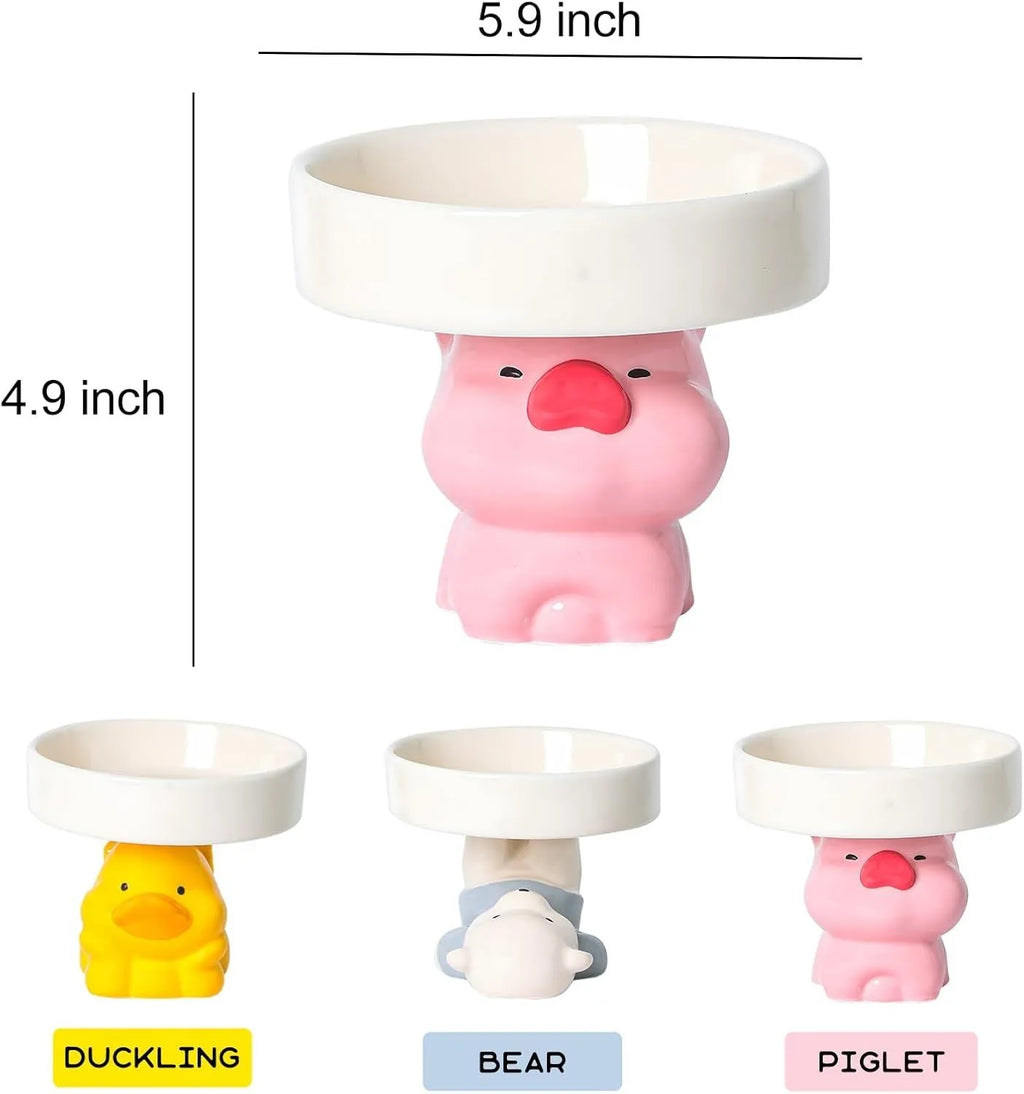 Raised ceramic cat food bowl in animal theme design, showing elevated height and wide bowl.