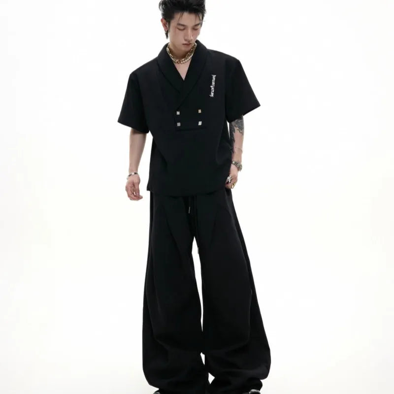 Men's dark grey cotton sports suit with padded shoulder jacket and matching shorts with metal embellishments