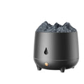 Black and white volcano-shaped ultrasonic humidifier with USB cable on a desk.