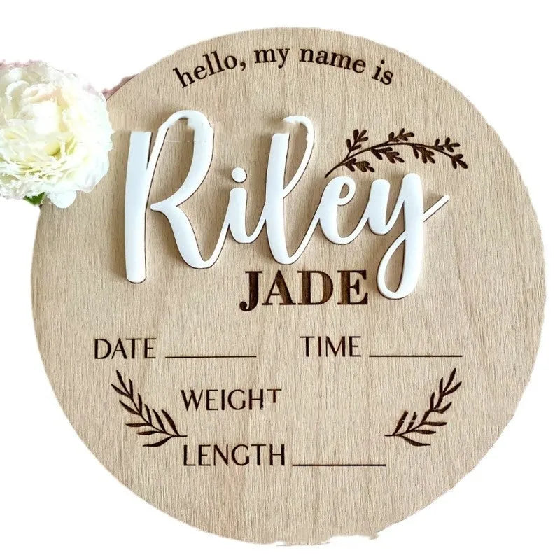 Square wooden baby name plaque showing birth information, 15cm on each side.