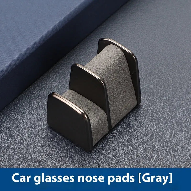 Zinc alloy car glasses clip with leather pad in choice of colours for dashboard or visor.
