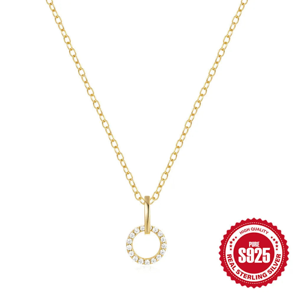 Gold-colour sterling silver necklace with geometric zircon pendant on an adjustable clavicle chain.