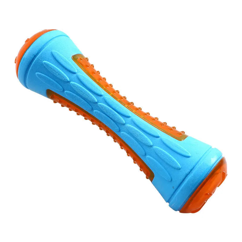 Set of three floating TPR dog toys: a blue ball, an orange barbell, and green tyres on a pool edge.