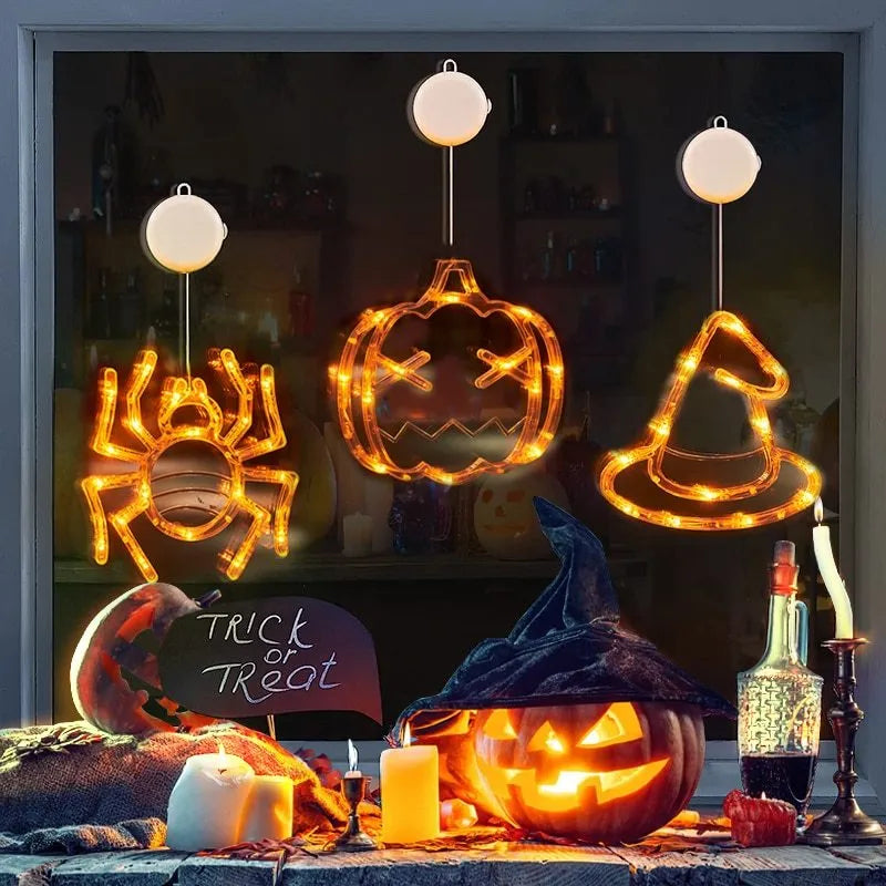 Seven Halloween-themed LED hanging lights with suction cups including spiders, pumpkins and ghosts