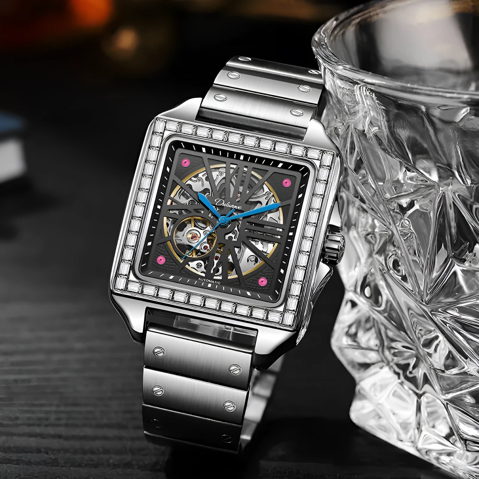 Men's square automatic watch with a diamond-studded dial on a black steel bracelet.