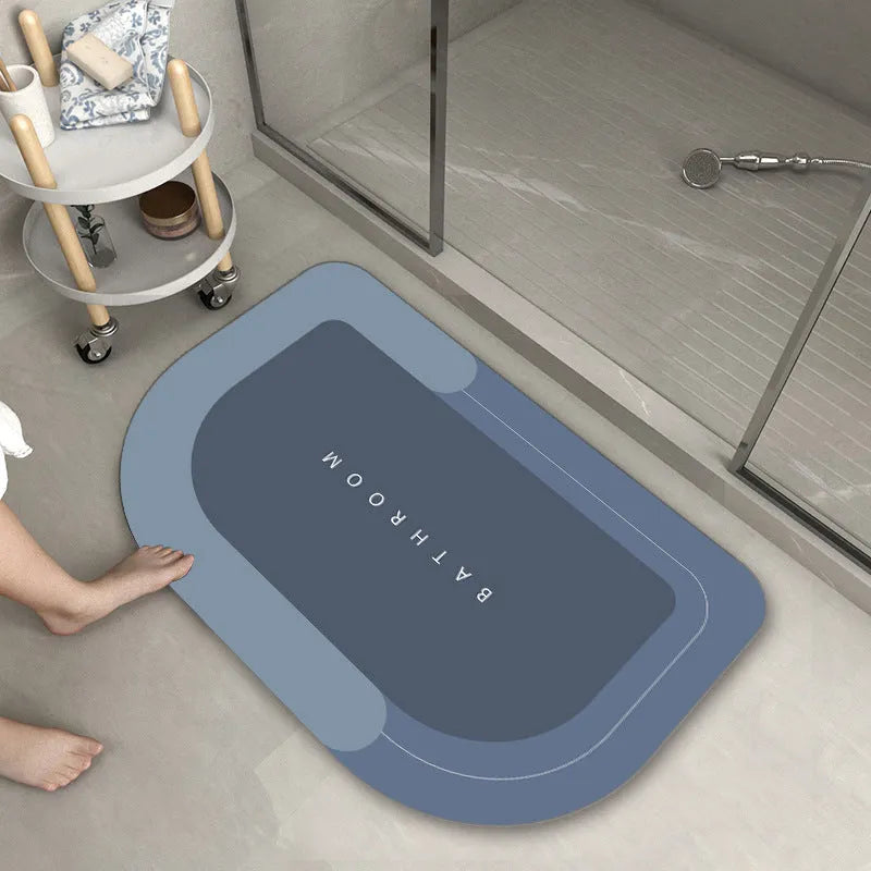 Blended fabric bathroom floor mat in oval and rectangular shapes on a tiled floor.