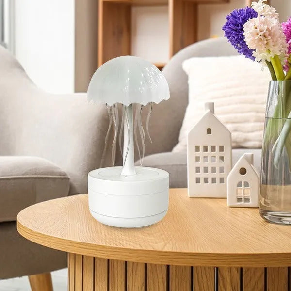 White jellyfish humidifier diffuser with colourful night light on desktop