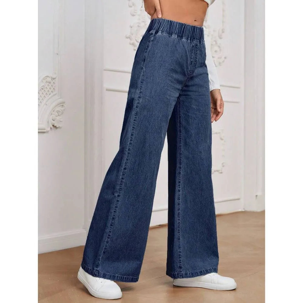 Light blue washed wide-leg denim trousers for plus size figures with mid waist and straight leg silhouette