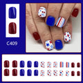 Short glossy false nails with red and blue strawberry and cherry Independence Day design