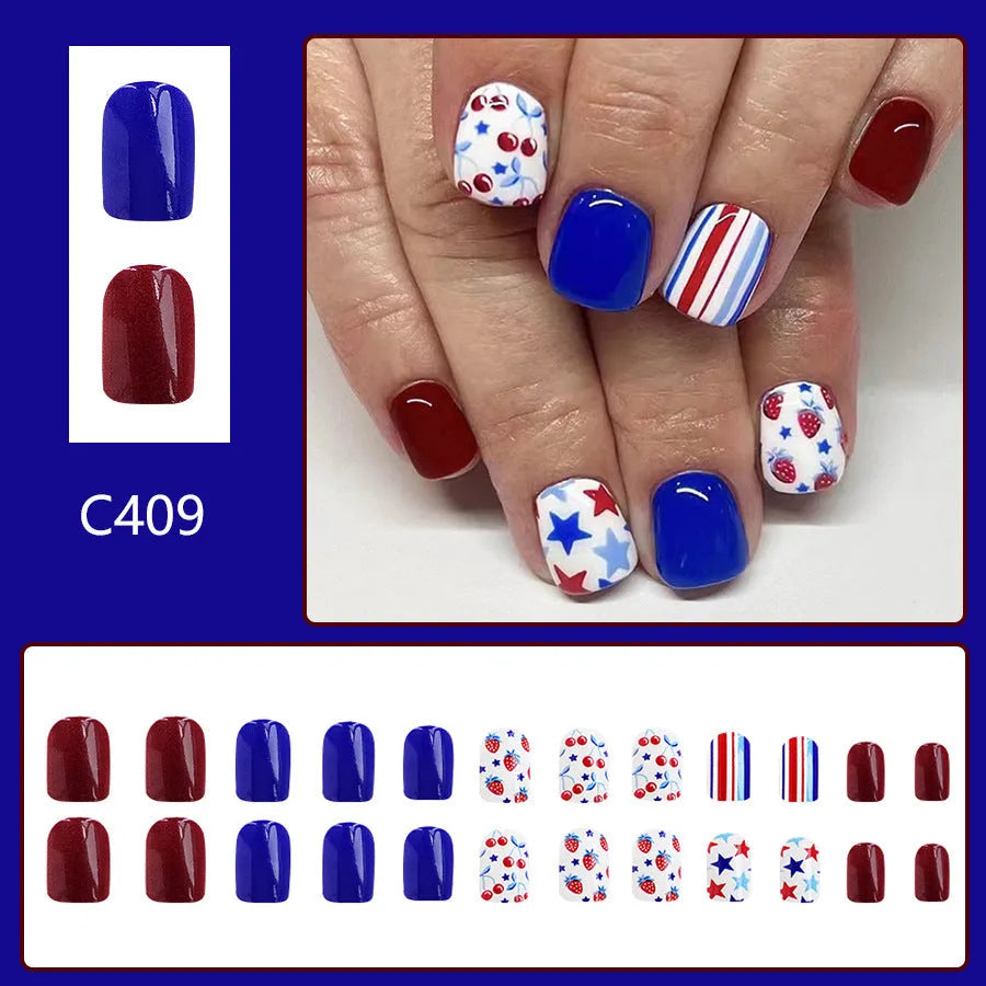 Short glossy false nails with red and blue strawberry and cherry Independence Day design