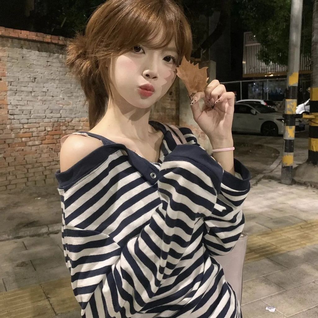 Dark blue oversized women's T-shirt with embroidery, buttons, and striped details in Korean style
