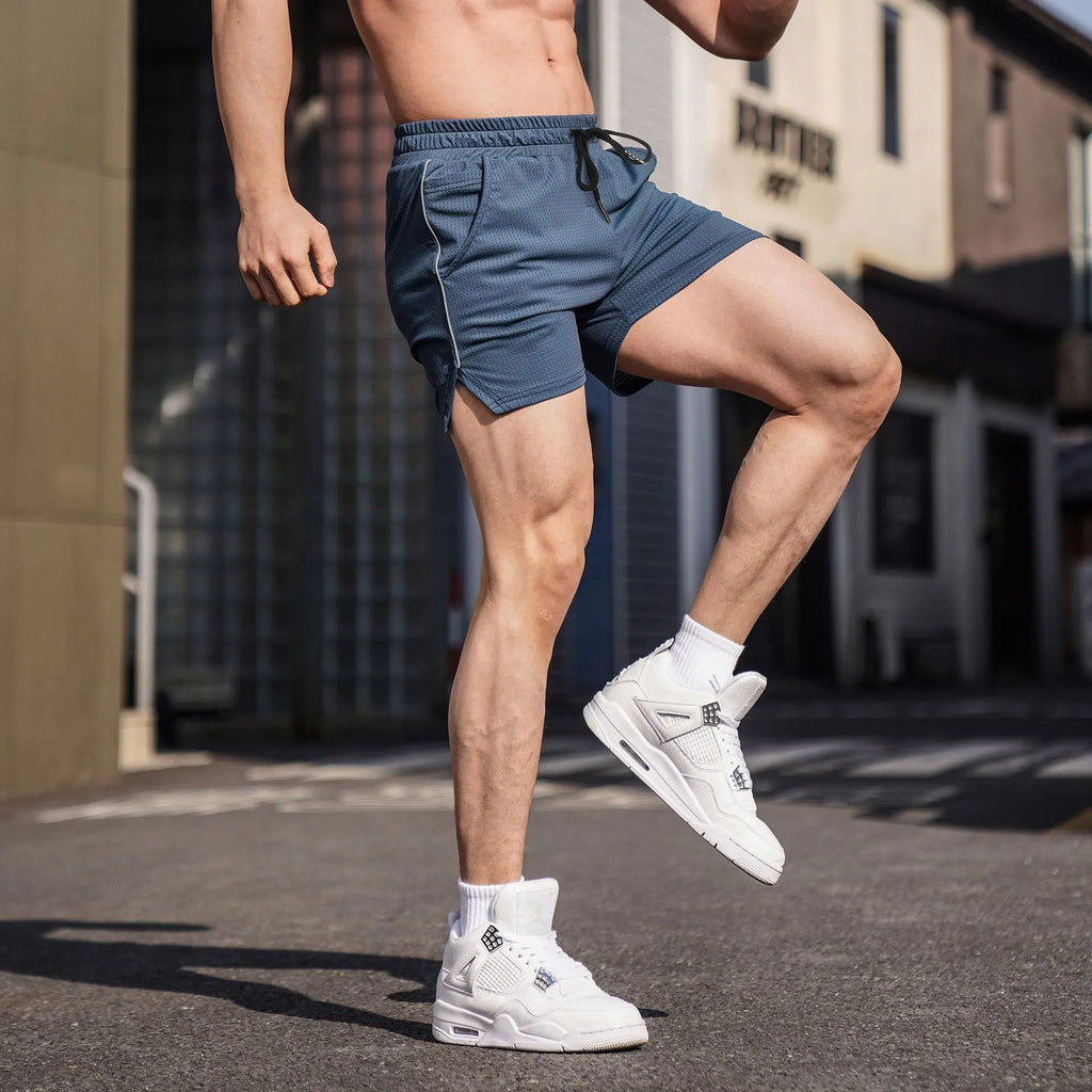 Men's straight-leg polyester fitness shorts in black, shown in a sports casual style.