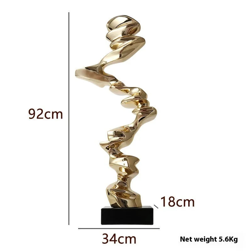Modern abstract decorative ornament made from natural resin in a choice of gold, silver, or blue.