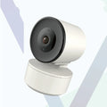 Smart WiFi security camera with PTZ rotation on desktop with mobile app display