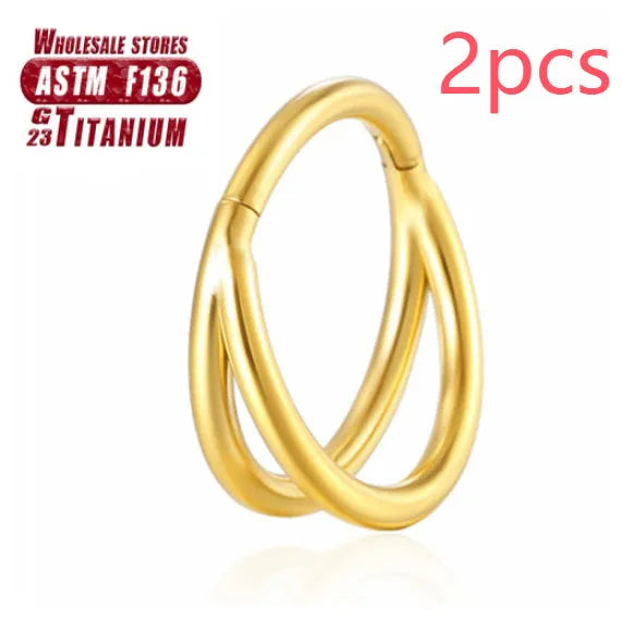Titanium alloy nose ring on a plain background, shown in silver and gold finishes.