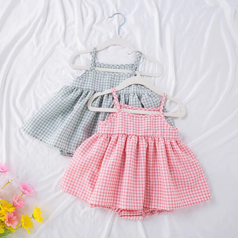 Baby girl in Korean style plaid princess sling romper dress in light green on white background