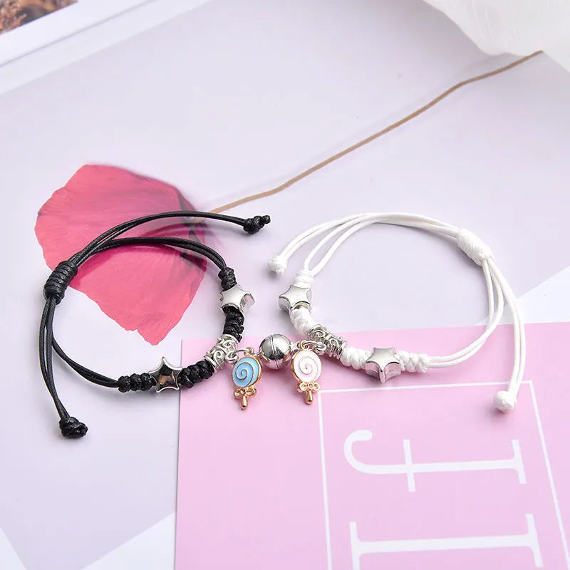 Magnetic couple bracelet pair with alloy electroplating in various designs including clover and crown patterns