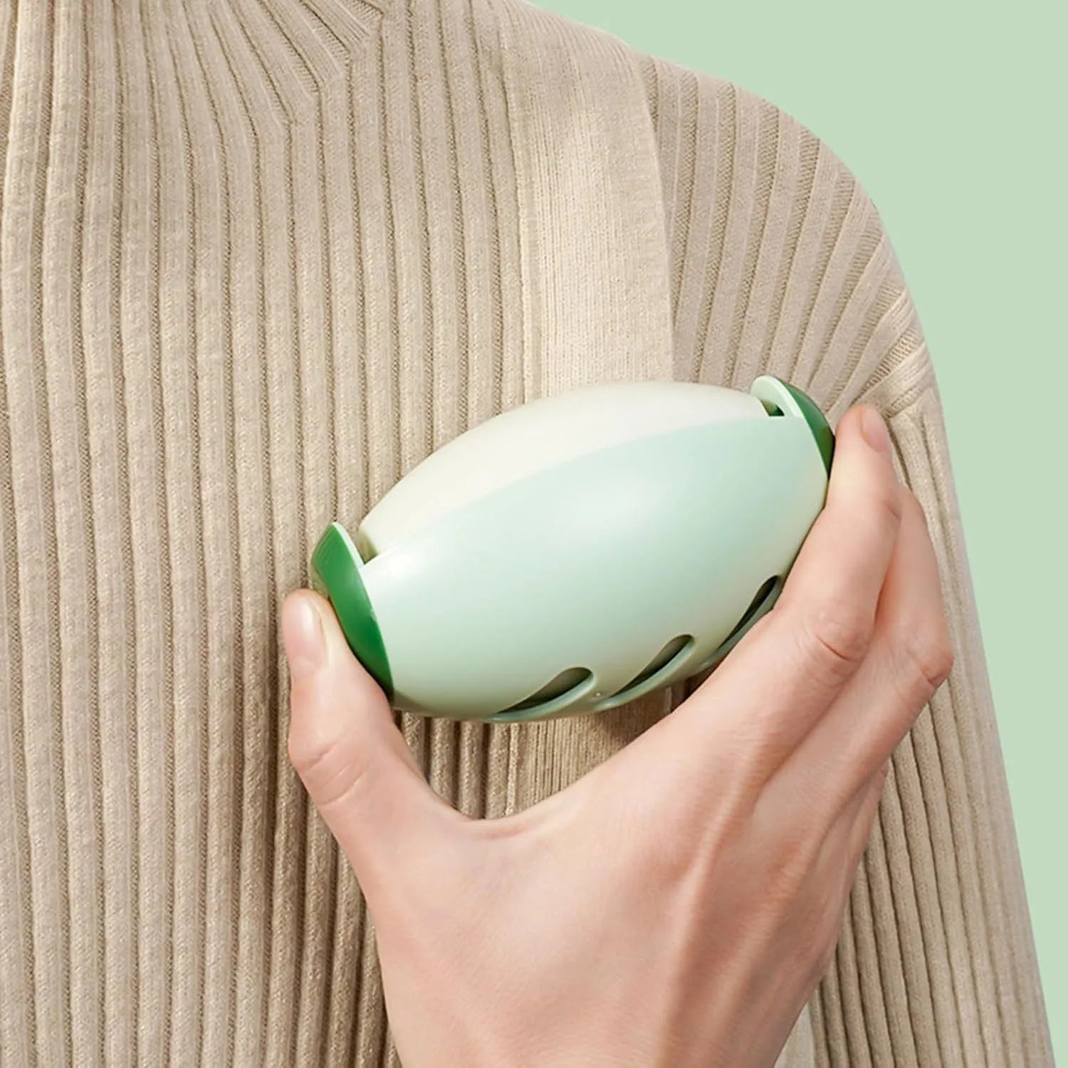 Green reusable gel lint roller ball for pet hair removal from clothes and furniture