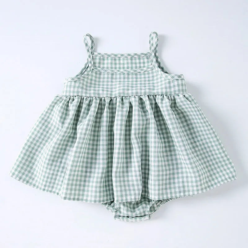 Baby girl in Korean style plaid princess sling romper dress in light green on white background