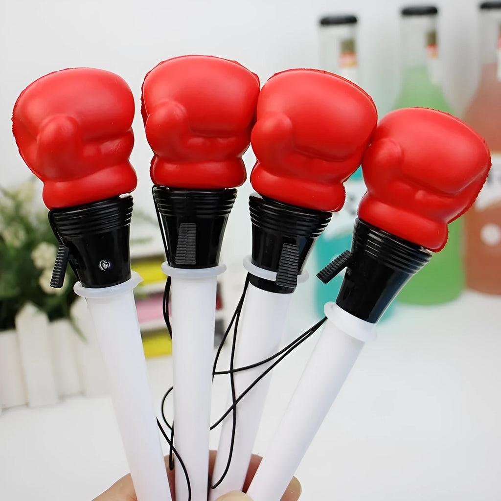Four pressure relief boxing press ejection pens with black refills and 0.7mm bullet tips