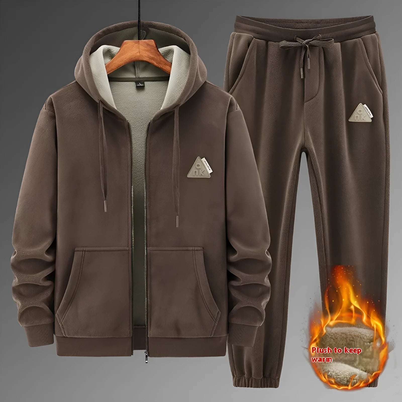 Man wearing a grey hooded sweater and matching trousers from a men's two-piece casual sports suit set.