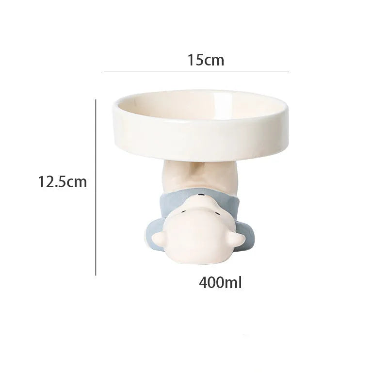 Raised ceramic cat food bowl in animal theme design, showing elevated height and wide bowl.
