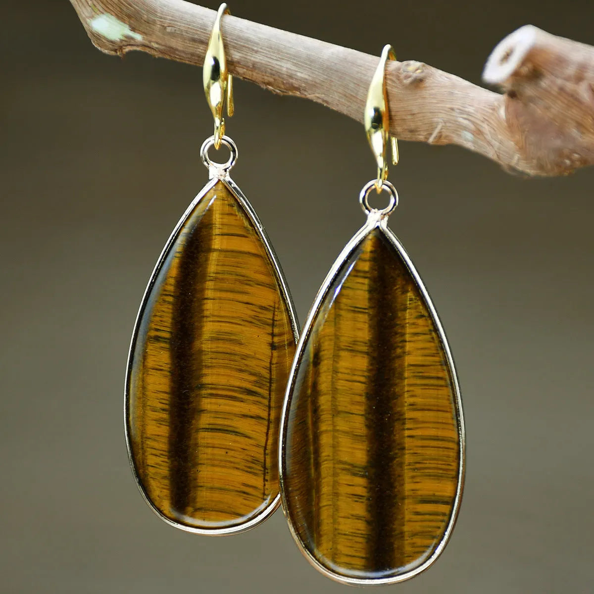Vintage tigereye stone drop earrings with elongated water drop shape and textured elements