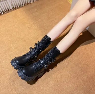 Black women's mid-calf knight boots with a metal buckle and side zip on a white background.