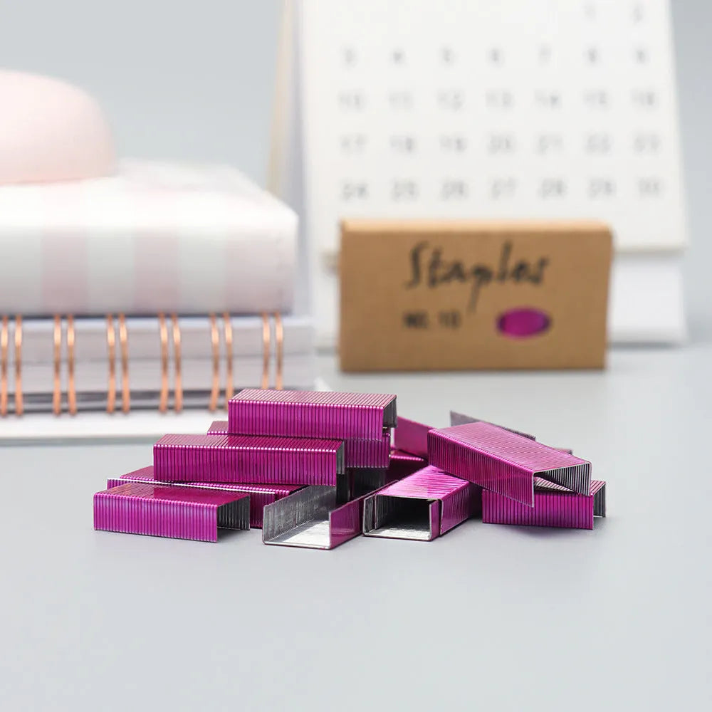 Box of 1000 metal office staples in rose gold, black, purple, and rose red colour options