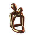 Modern resin couple statue figurine in milk white or gold finish for shelf or desk decor.